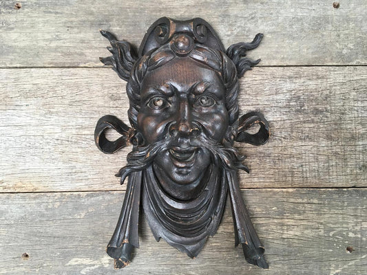 Moustachioed Man Carving